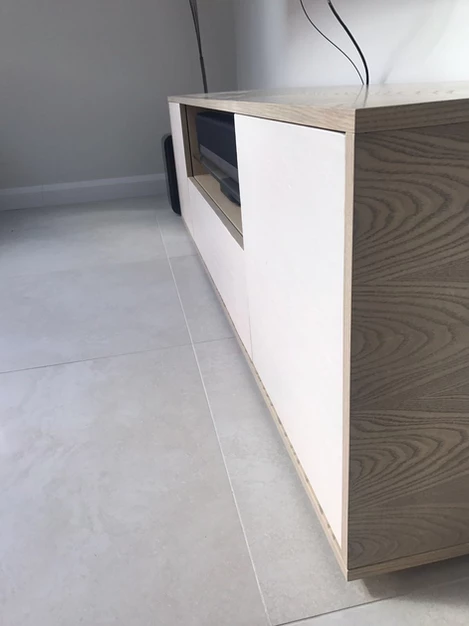 Ice Pearl limestone veneer cladding on media cabinet drawers