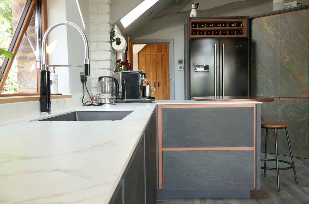 Nero slate veneer cladding on contemporary kitchen cabinet doors