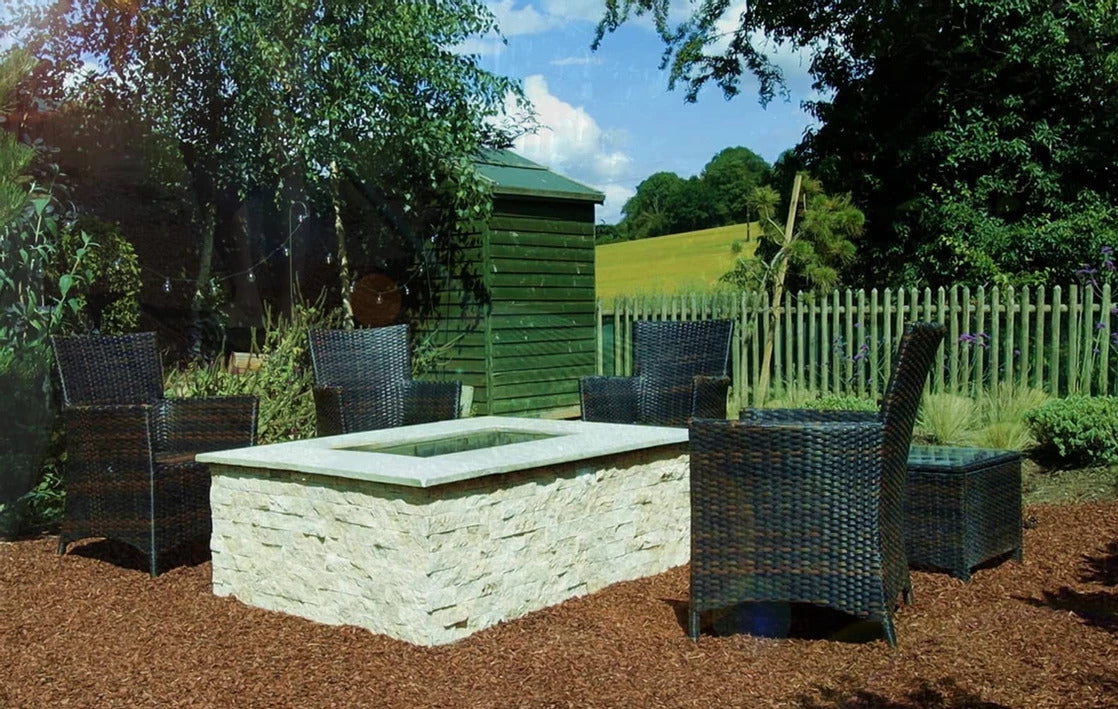 Classic travertine split face cladding on garden fire pit