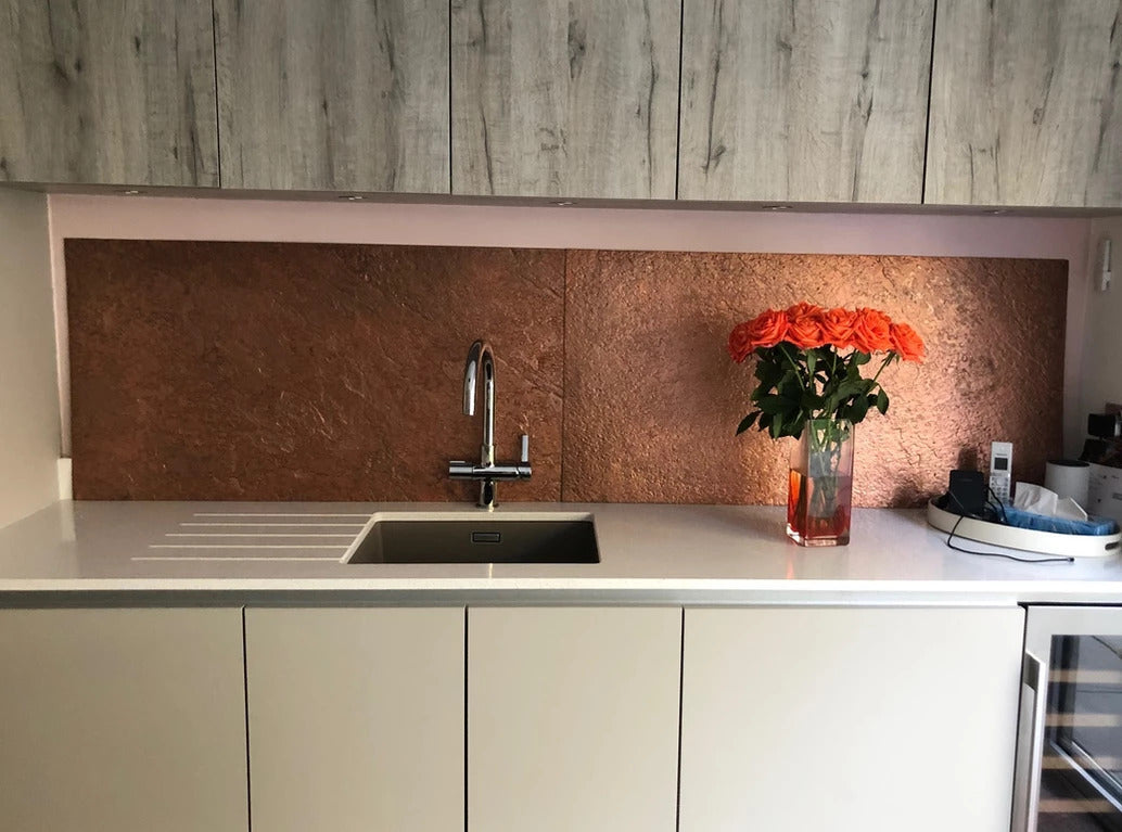 Copper metal veneer kitchen splashback with white worktop