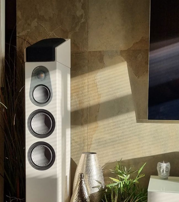 Tan natural slate veneer media wall with TV and speaker
