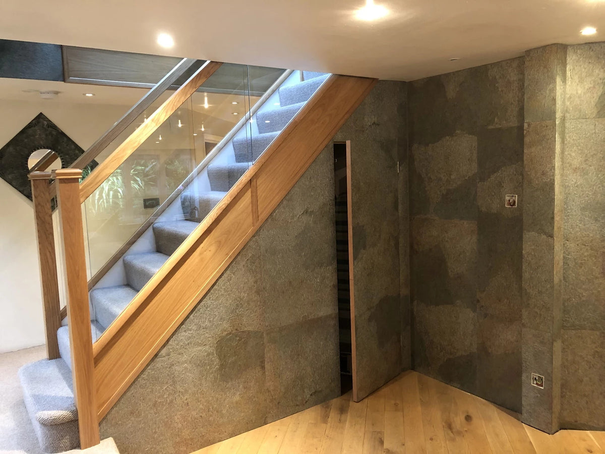 Argento Auro slate veneer feature wall beside wooden staircase