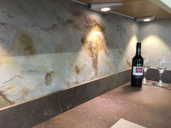 Bianco slate veneer kitchen feature wall with display lighting