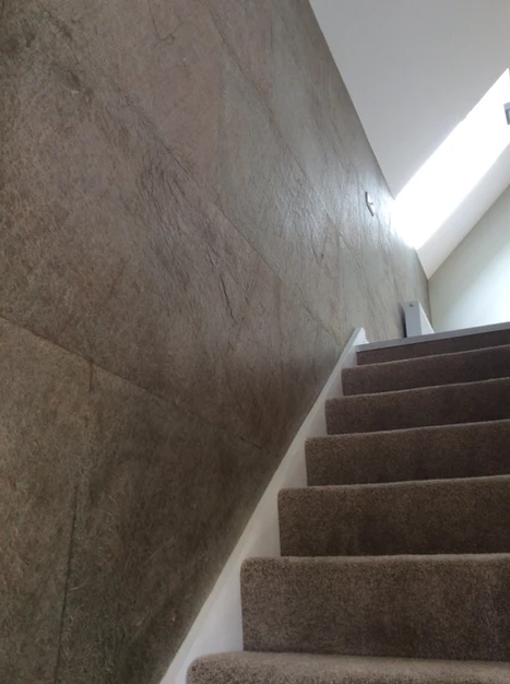 Cobre slate veneer feature wall alongside staircase