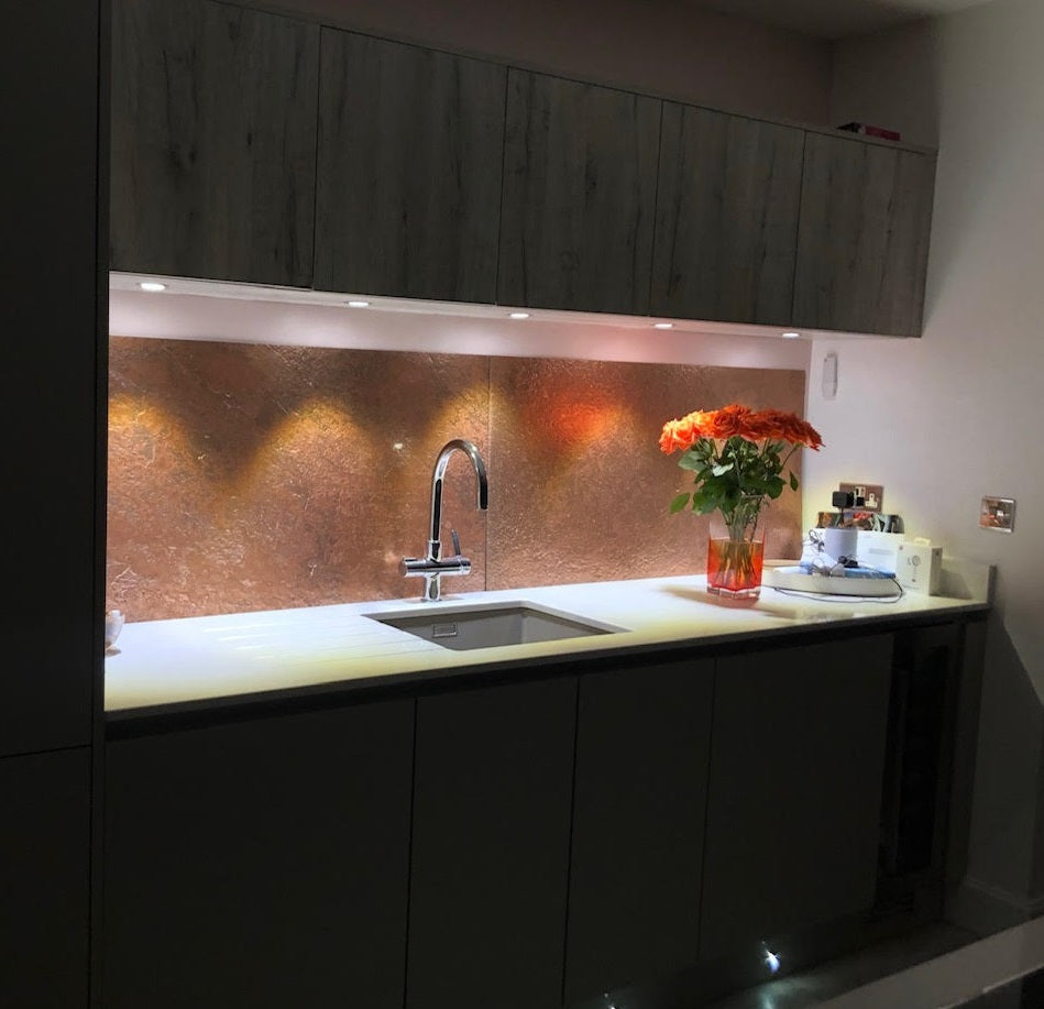 Copper metal veneer kitchen splashback with under-cabinet lighting