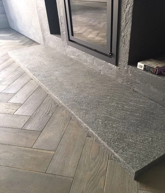 Galaxy Black slate veneer used on contemporary fireplace hearth