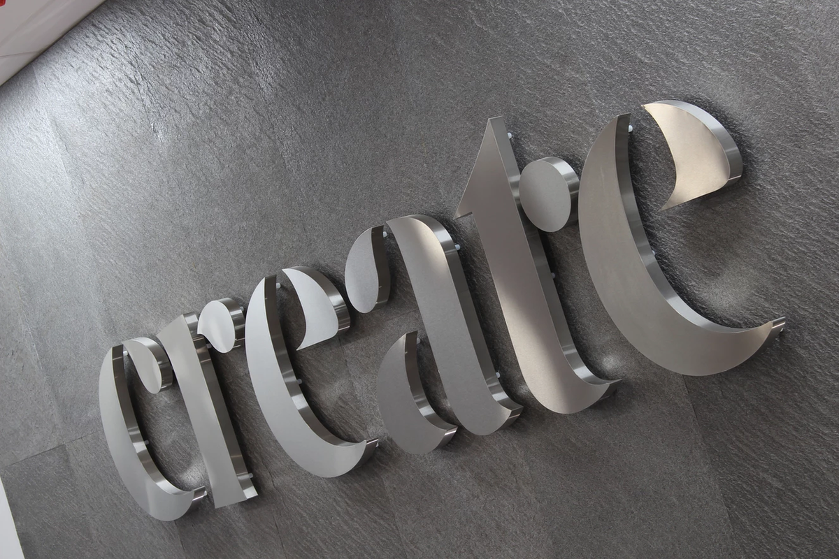 Galaxy Black slate veneer wall with raised metal signage
