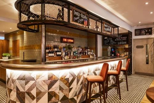 Mixed slate stone and marble veneers used on bar front cladding