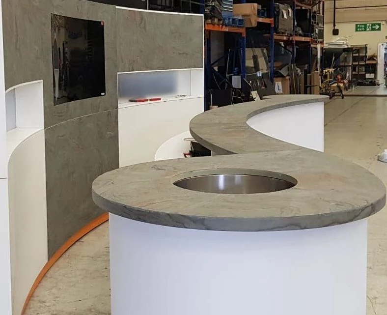 Molto Rosa slate veneer cladding on exhibition stand and counter