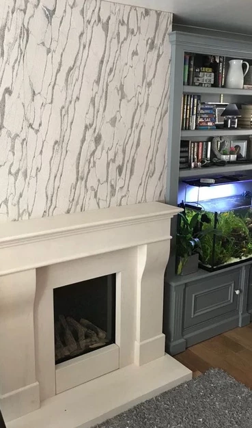 Mystic White marble veneer feature wall above fireplace