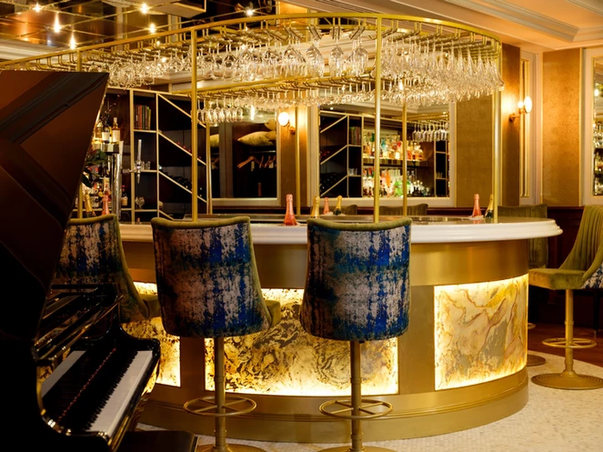 Backlit Rustique and Falling Leaves translucent slate veneer curved bar panels