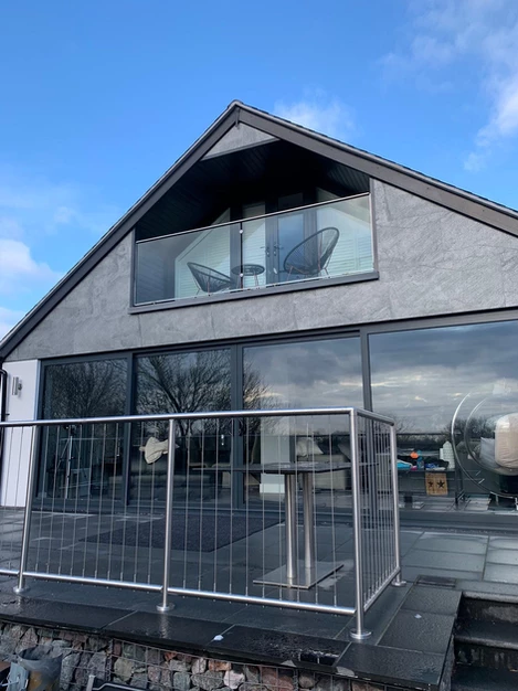 Silver Grey slate veneer exterior cladding on contemporary house