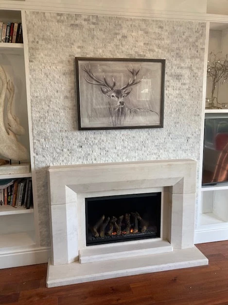 White marble split face cladding fireplace feature wall