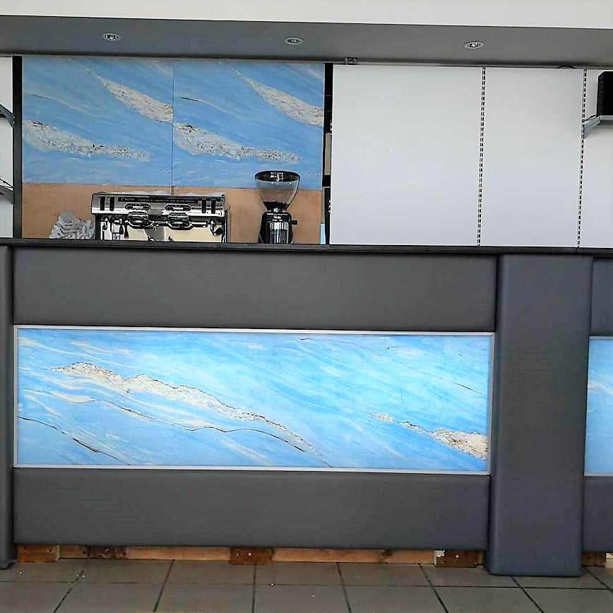 Back-lit Palisandro Blue translucent stone veneer bar front