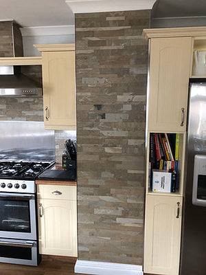 Tan slate veneer multi brick pattern kitchen feature wall