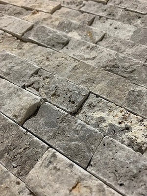 Silver travertine split face cladding stone tile close up