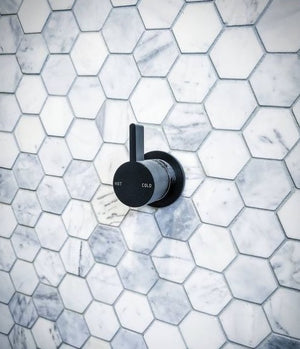 Carrara white marble hexagon mosaics bathroom wall close up